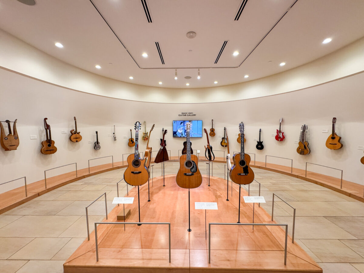 Museum display of many guitars