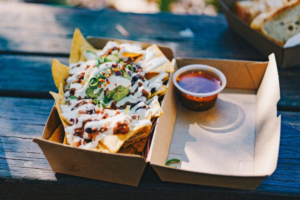 Close-up of loaded nachos with guacamole and salsa at an Arizona restaurant.